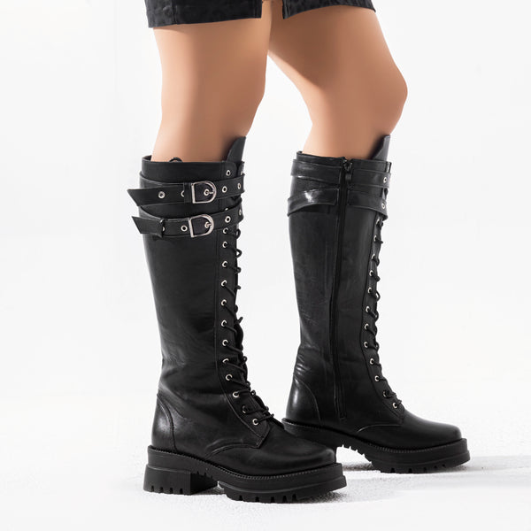 knee-high combat boots have a lace-up front, chunky sole, and two buckle straps B-37